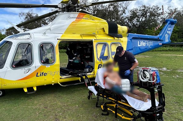 A man has been flown to hospital after being bitten by a shark while snorkelling.