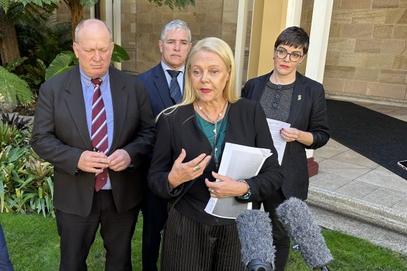 Noosa MP Sandy Bolton (centre) was the first head of an independent policy committee in at least two decades.