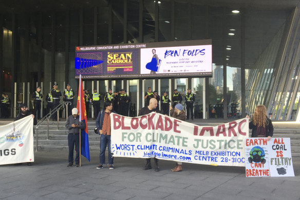 Protesters begin to gather for the first day of the International Mining and Resources Conference (IMARC).