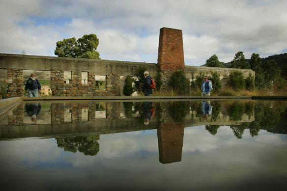 A reflective memorial pool behind the remains of the Port Arthur cafe.