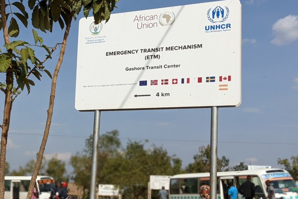 Sign displaying the UNHRC and EU logos pointing the way to the refugee processing centre at Gashora, Rwanda.