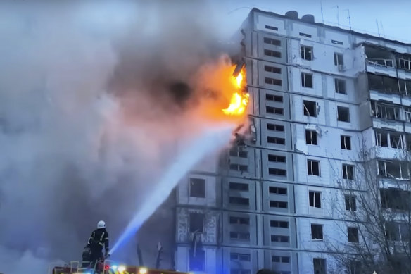 Firefighters work at an apartment building destroyed by a Russian attack in the town of Uman, south of Kyiv on Friday.
