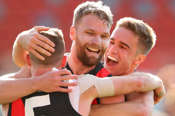 Devon Smith, Jake Stringer, and Matt Guelfi celebrate a key goal.