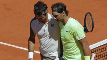 Well played: Roger Federer congratulates Rafael Nadal.