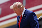 President Donald Trump disembarks Air Force One at Dobbins Air Reserve Base.