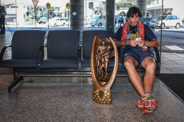 Just me and my little mates … Johnathan Thurston with the Provan/Summons trophy after winning the grand final in 2015.