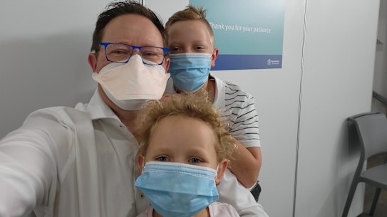 Infectious disease physician Paul Griffin takes a selfie with children Max, 11, and Chloe, 6, as they have their COVID vaccinations.