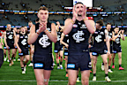 Patrick Cripps and Marc Pittonet lead the resurgent Blues off the ground on Saturday.
