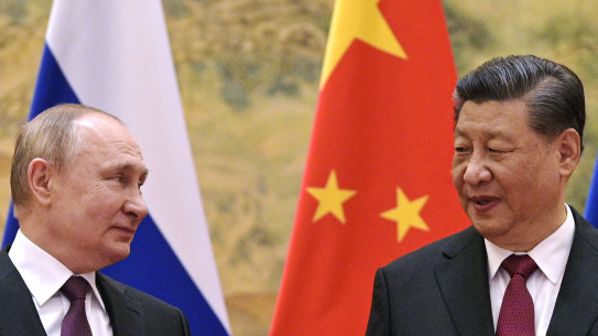 Getting closer: Chinese President Xi Jinping, right, and Russian President Vladimir Putin.