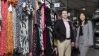 GlamCorner co-founders Dean Jones and Audrey Khaing-Jones in their Alexandria warehouse, which houses some 28,000 pieces of clothing for rent.