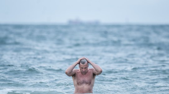 Brr: Peter Brydon went for a dip at Middle Park beach on Friday morning. 