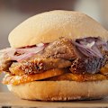 Pan con chicharron … a pork sandwich with slices of sweet potato and salsa criolla.