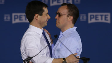 Pete Buttigieg, left, is joined by his husband Chasten Glezman after announcing he will seek the Democratic presidential nomination.
