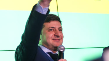 Ukrainian comedian Volodymyr Zelenskiy, flashes the victory sign at the end of the presidential elections.