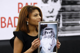 Ensaf Haidar, the wife of jailed Saudi Arabian blogger Raif Badawi, pictured in 2015 with portrait of her husband.