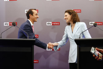 Liberal candidate for Wentworth Dave Sharma and independent rival Allegra Spender shake hands ahead of the debate.