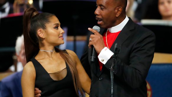 Bishop Charles Ellis, right, with Ariana Grande after her performance.