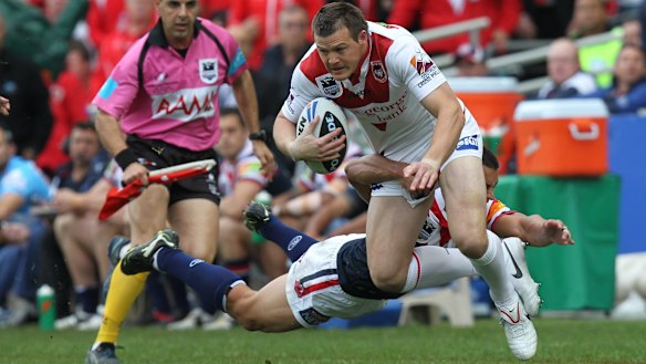 Brett Morris tries to make a break during the 2010 grand final when playing for the Dragons against the Roosters.