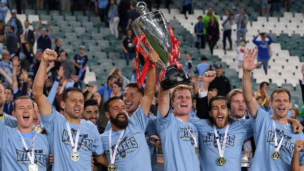 Sydney FC players celebrate their FFA Cup final victory last year.