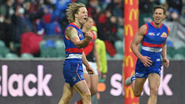 Cody Weightman of the Bulldogs celebrates kicking a goal.