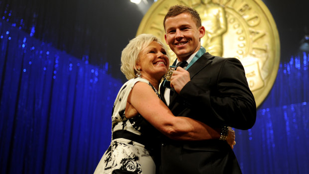 Mother's love: Leanne and Todd Carney after presentation of the 2010 Dally M medal.