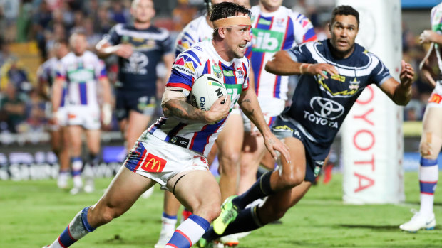 Determined: Knights co-captain Mitchell Pearce heads towards the try line.