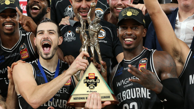 Melbourne United's Chris Goulding (left) and Casey Prather celebrate after winning the NBL grand final series. 
