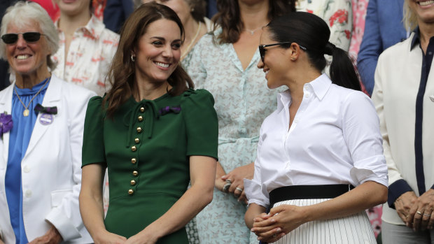 Kate, Duchess of Cambridge, and Meghan, Duchess of Sussex, at the tennis in 2019.