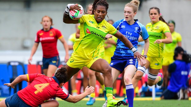 Starring role: Ellia Green on the charge for Australia against Spain.
