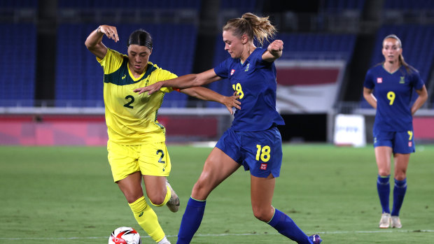 Matildas captain Sam Kerr is challenged by Sweden’s Fridolina Rolfo.