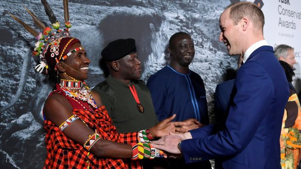 Prince William, Duke of Cambridge congratulates Award finalist, Jeneria Lekilelei, during the Tusk Conservation Awards in London.