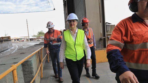 Premier Annastacia Palaszczuk dons the first hardhat of the campaign on 
her visit to the Mount Isa Copper Smelter