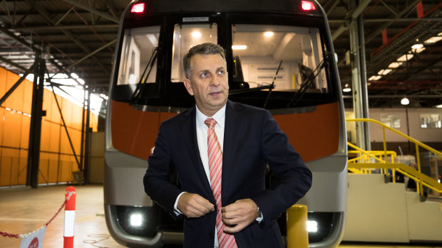 Transport Minister Andrew Constance in front of a mock of a new intercity train.