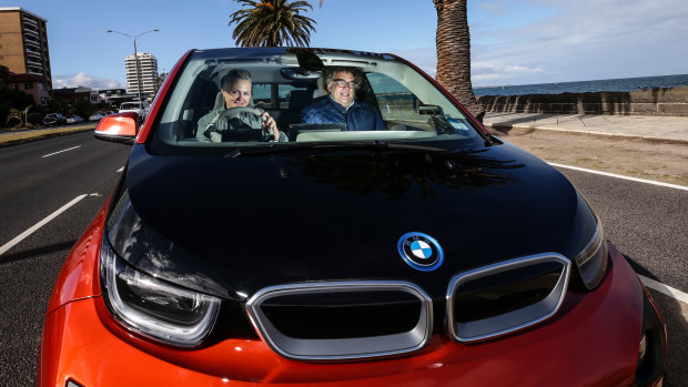 “I love my car," says electric vehicle owner Brigid Niall, pictured with husband Jock Main.