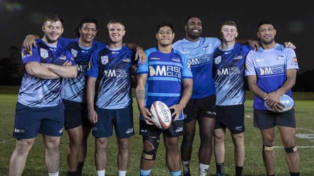 Western Sydney Two Blues players Ethan Caine, Irie Papuni, Tom Curtis, JP Sauni, Manasa Rokosuka, Joe Bedlow and Sione Fifita before training at their home ground in Merrylands. 