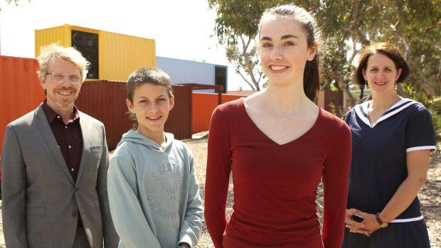 German International School Principal Lorenz Metzger, students Felix Scholle and Nadia Kuepper, and teacher Tanja Ritonnale.