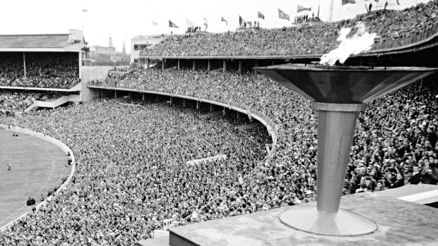 The Olympic flame slowly dies as it is extinguished to mark the closing of the 1956 Games.