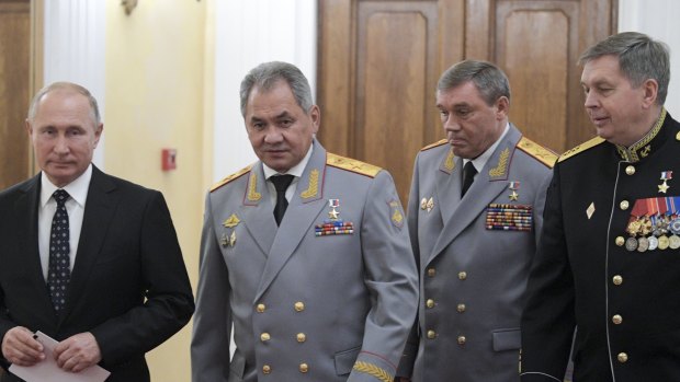 From the left: Russian President Vladimir Putin, Defence Minister Sergei Shoigu, First Deputy Defence Minister Valery Gerasimov, and Deputy GRU chief, Vice Admiral Igor Kostyukov, who Germany wants to sanction. 