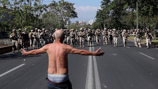 A man challenges soldiers during clashes in Santiago.