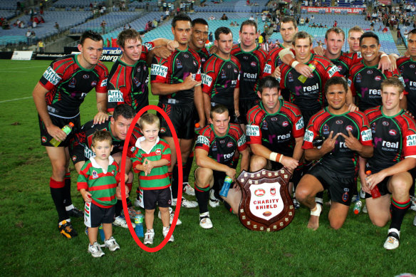 Sam Walker (circled) next to dad Ben and brother Jackson at the 2006 Charity Shield match.