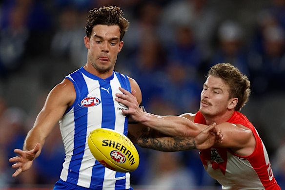 Jy Simpkin of the Kangaroos and Riley Bice of the Swans.