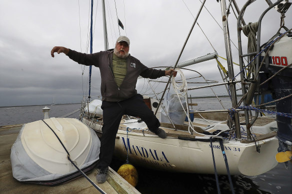 Dana Burchatz, 57, secures his 34-foot Morgan sailboat at Lang’s Marina as he prepares for Hurricane Ian on Wednesday in Georgia.