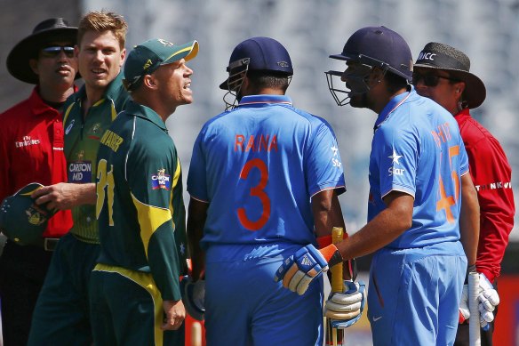 David Warner argues with India’s Rohit Sharma during an ODI at the MCG in January 2015.
