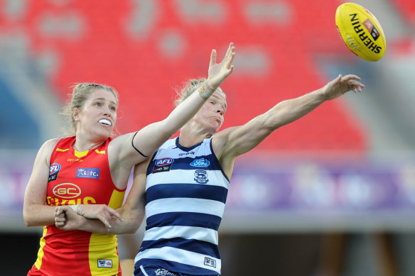 Gold Coast’s Shannon Danckert and Kate Darby of the Cats contest the ruck.