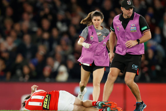 Hunter Clark of the Saints lays injured during the 2022 AFL Round 16 match between the Carlton Blues and the St Kilda Saints.