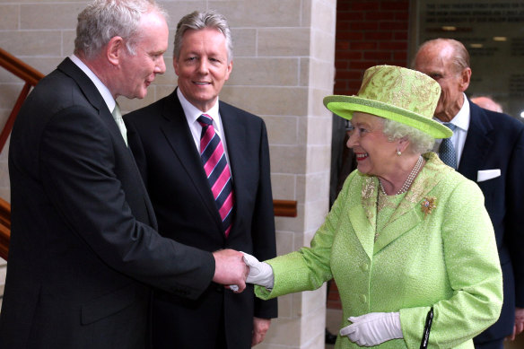 The famous June 27, 2012 photo of Queen Elizabeth II shaking hands with former IRA commander Martin McGuinness, who was by then Northern Ireland’s deputy first minister.