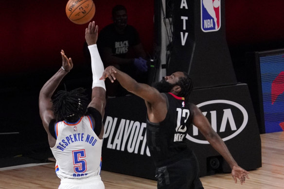 Houston's James Harden blocks a three-point attempt from Thunder's Luguentz Dort.