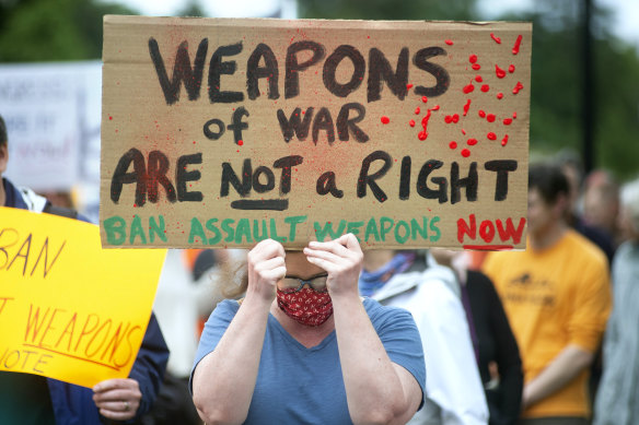 Chelsea Buchanan, of Olympia, Washington marches with other gun-control advocates during a rally at the state Capitol in Olympia, Washington on Saturday.