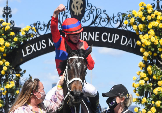 James McDonald punches the air as he returns on Verry Elleeegant after winning the Melbourne Cup.