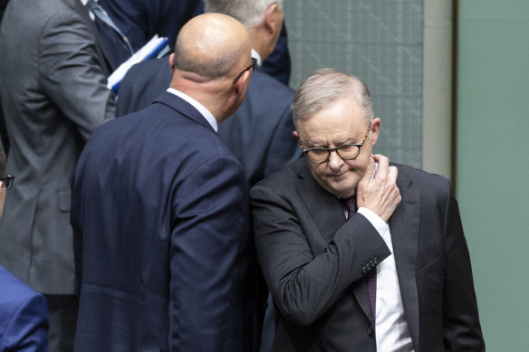 Opposition Leader Peter Dutton walks past Prime Minister Anthony Albanese during question time at Parliament House on Wednesday.